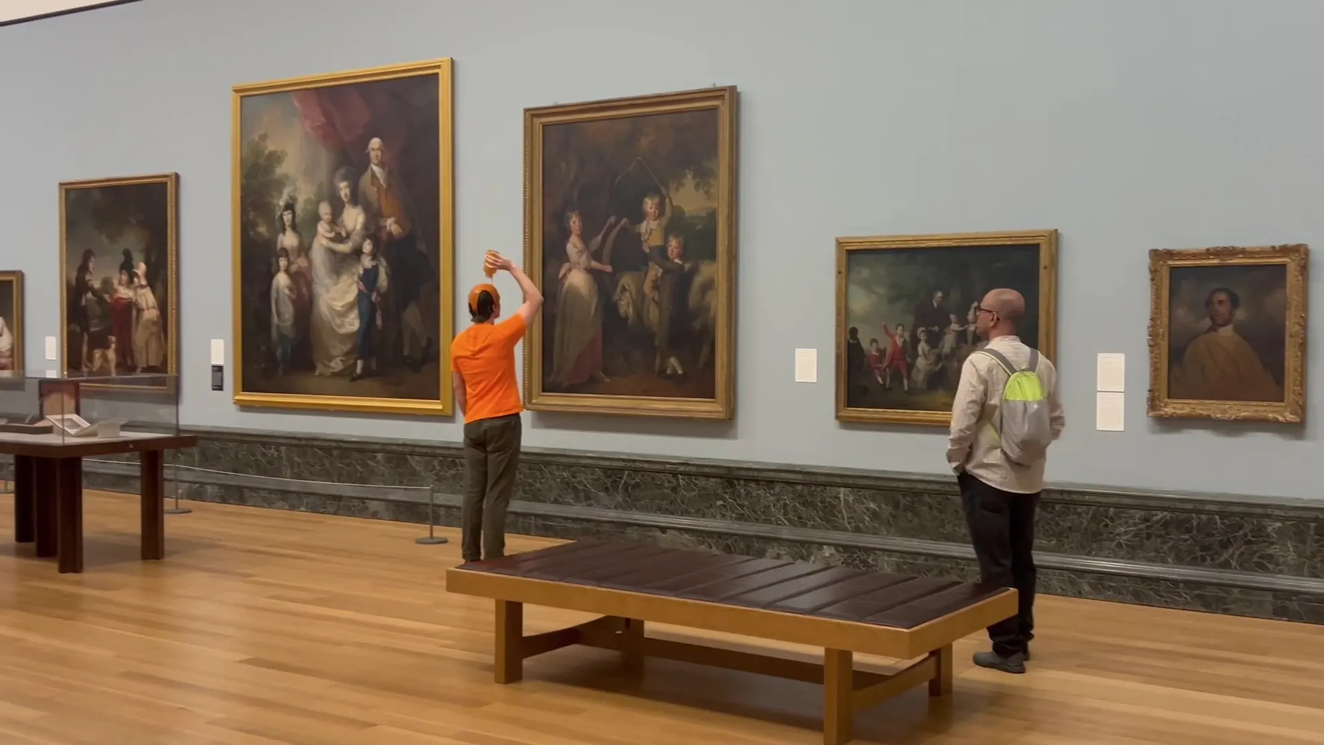 Graham pours a tin of soup over his own head in a gallery of oil paintings
